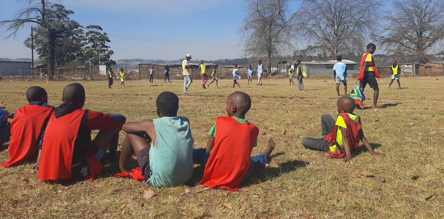 African youths watching a soccer game