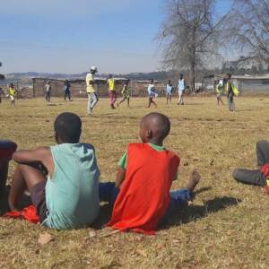 African youths watching a soccer game